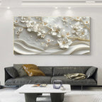 Decorative wall art with floral design above a gray sofa in a living room.