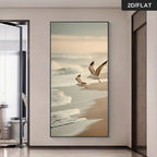 Framed artwork of two seagulls on a beach in a modern interior setting.