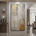 Abstract painting with gold and gray colors in a modern living room setting.