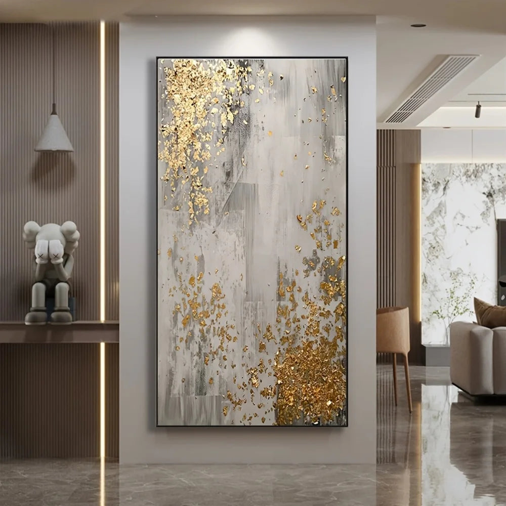 Abstract painting with gold and gray colors in a modern living room setting.