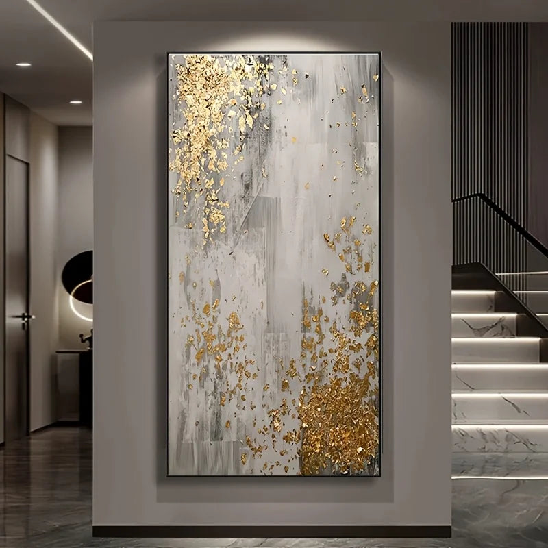 Decorative abstract painting with gold accents on a wall in a modern interior setting.