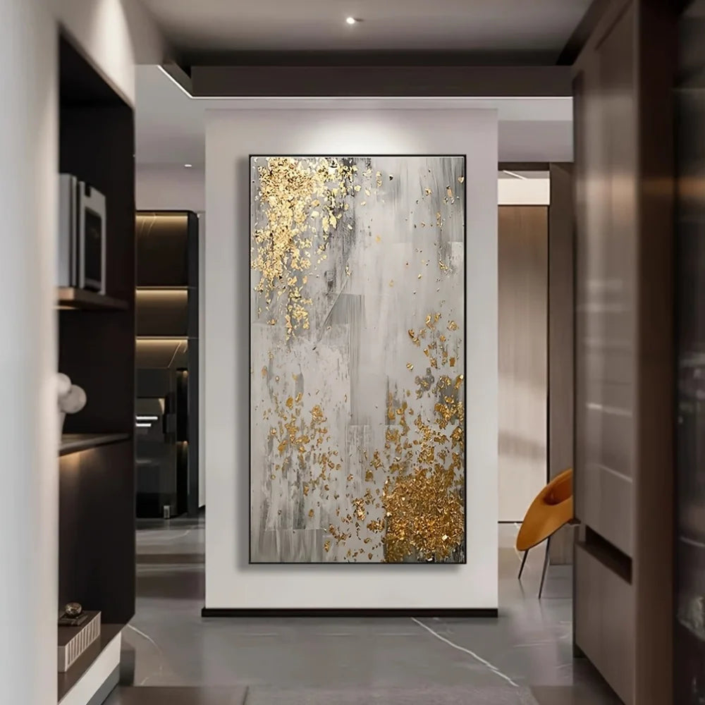 Modern interior with a large abstract painting featuring gold and gray colors.