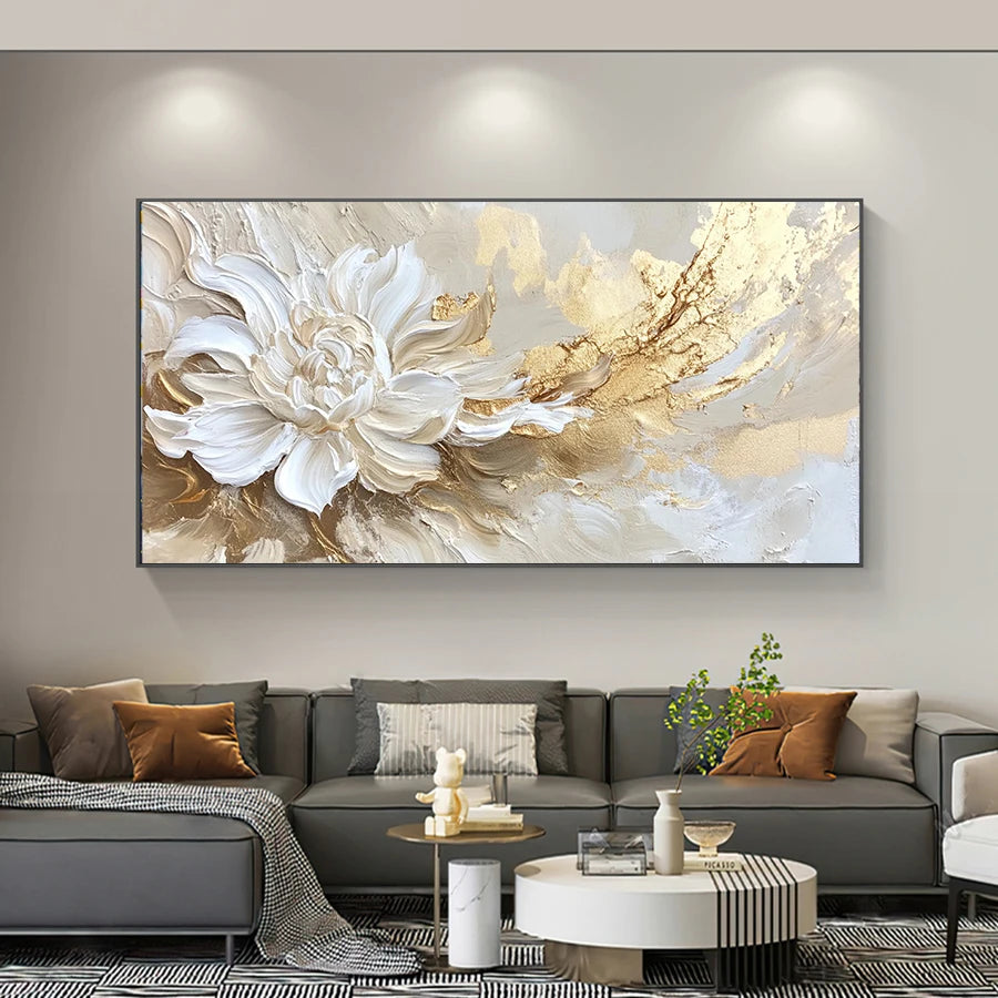 Living room with a large abstract floral painting on the wall above a gray sectional sofa.