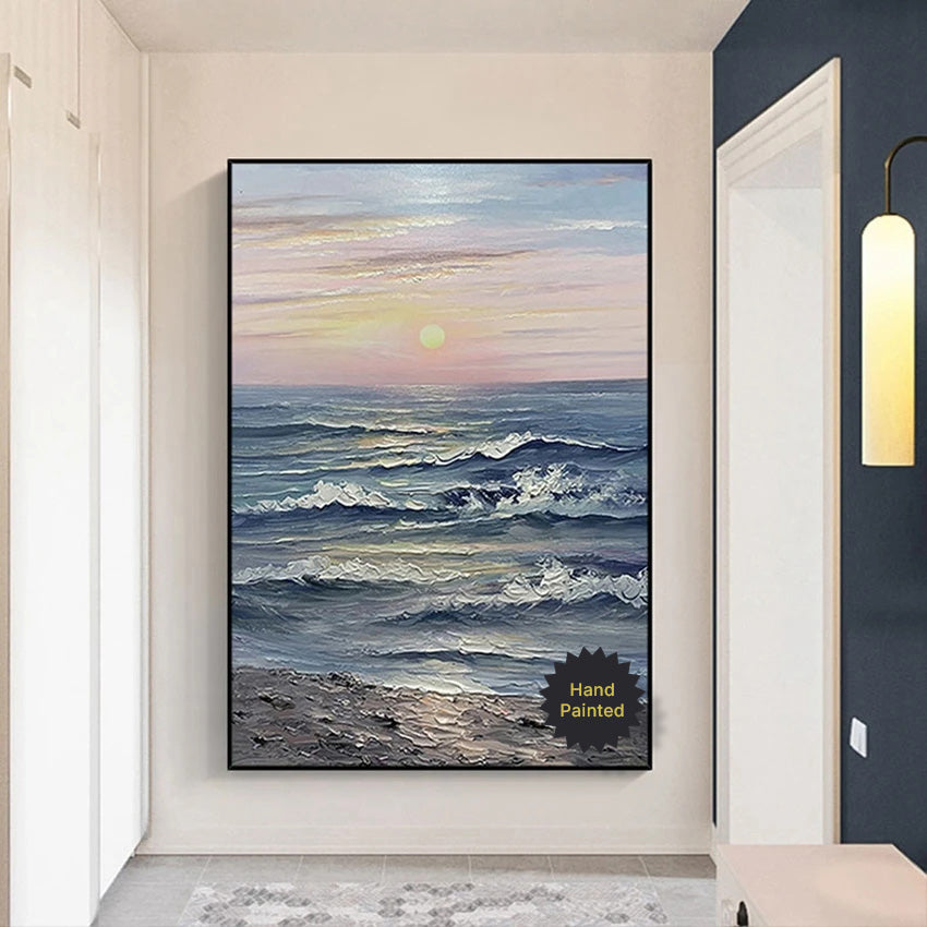 Framed artwork of a sunset over the ocean in a modern interior setting.