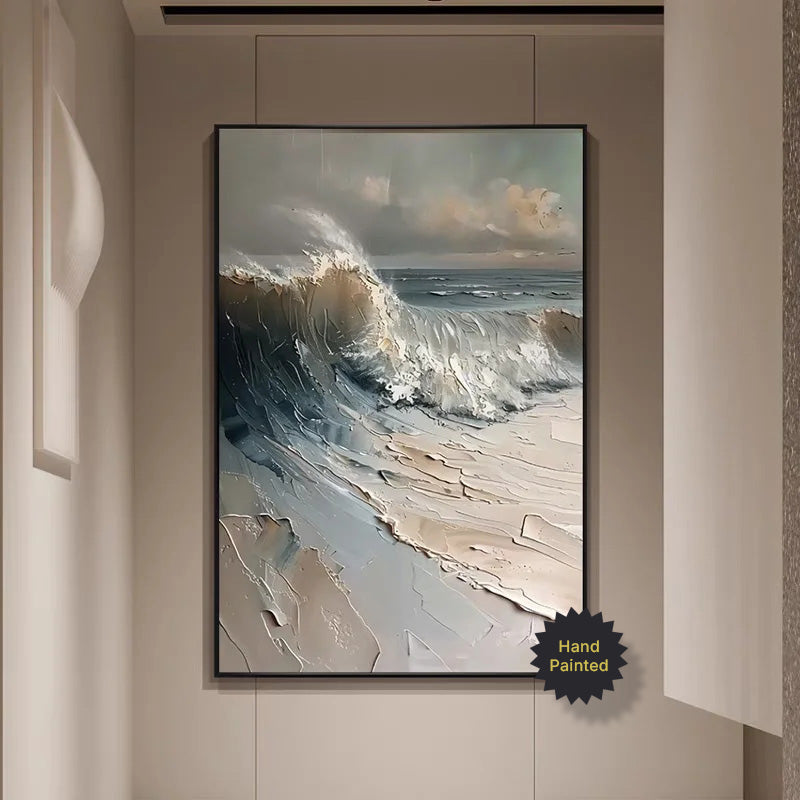 Framed painting of a wave crashing on a beach in a modern interior setting.