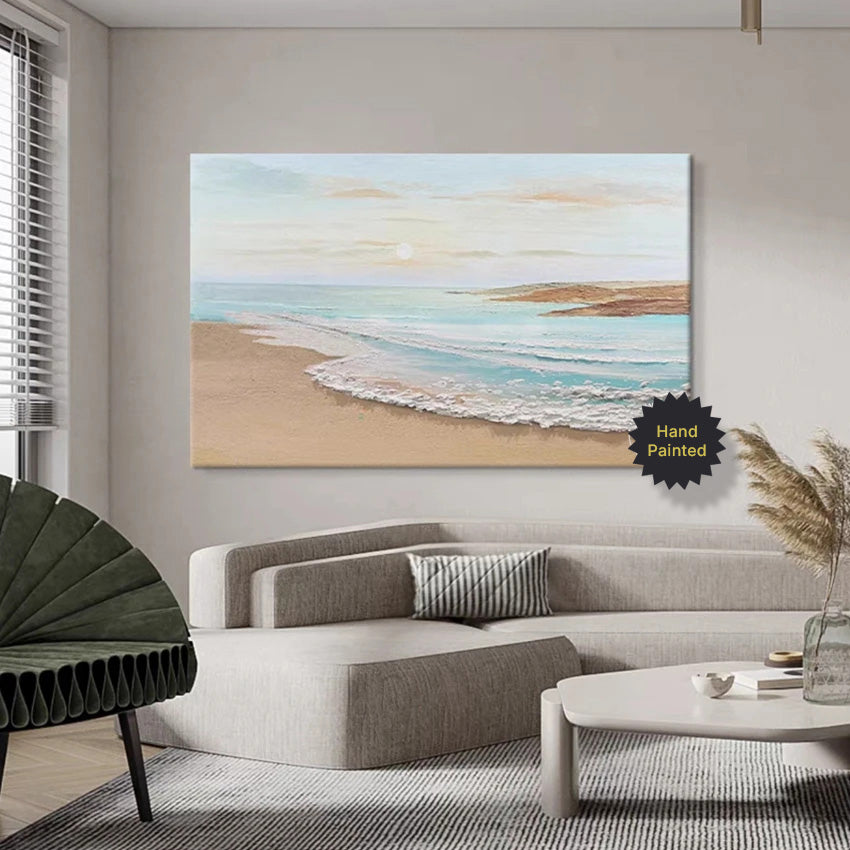 Living room with a beachscape painting on the wall, a sofa, and decorative elements.