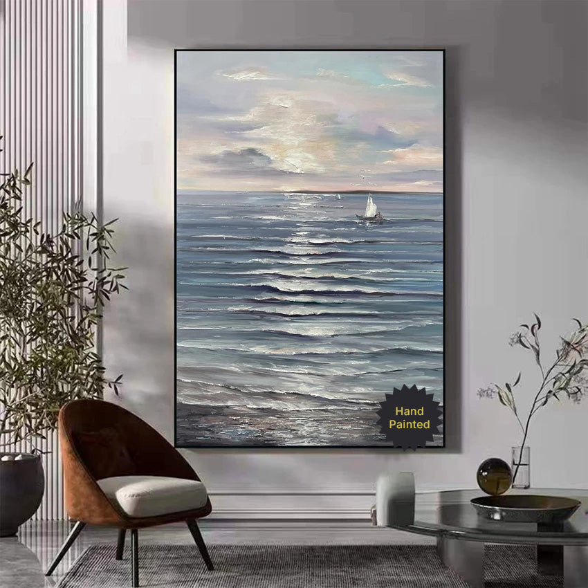 Framed painting of a seascape with a sailboat in a modern living room.