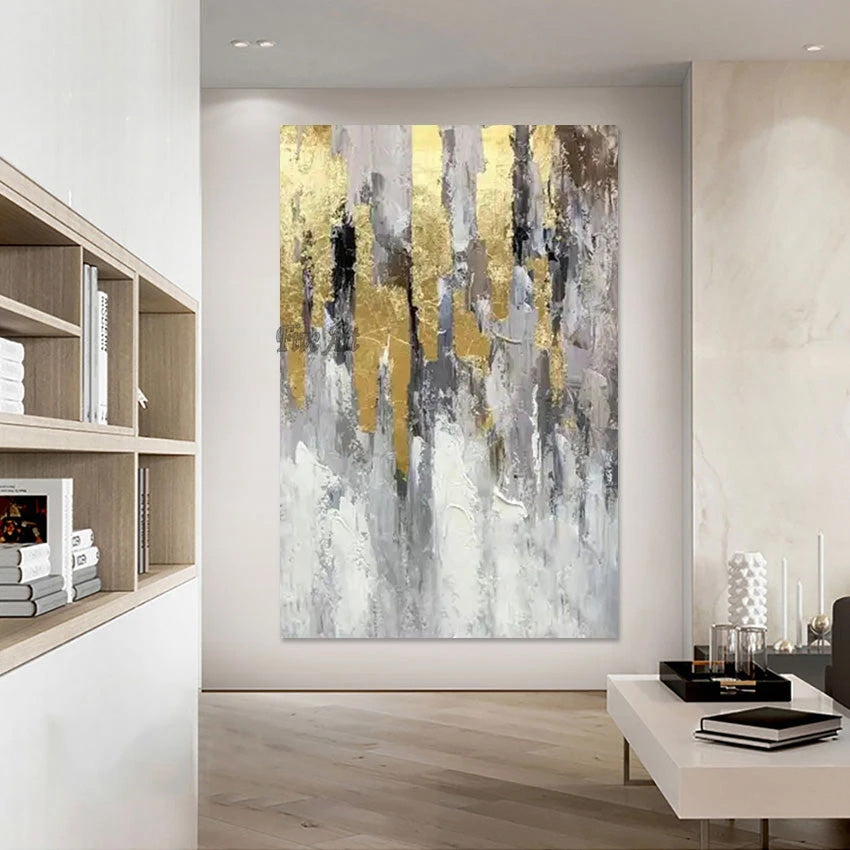 Abstract art piece with gold and gray tones in a modern living room setting.