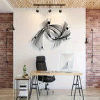 Modern office setup with a desk, chair, and decorative wall art.