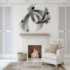 Modern living room with a white armchair, fireplace, and decorative wall art.