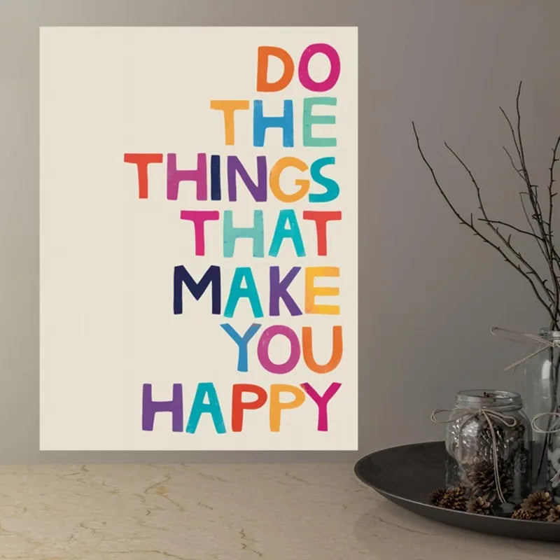 Motivational poster with colorful text on a wall above a decorative table.
