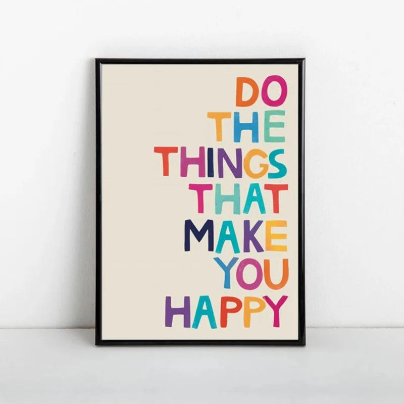 Framed poster with motivational quote 'Do the things that make you happy' in colorful letters on a white background.