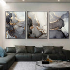 Modern living room with abstract wall art and a black leather sofa.