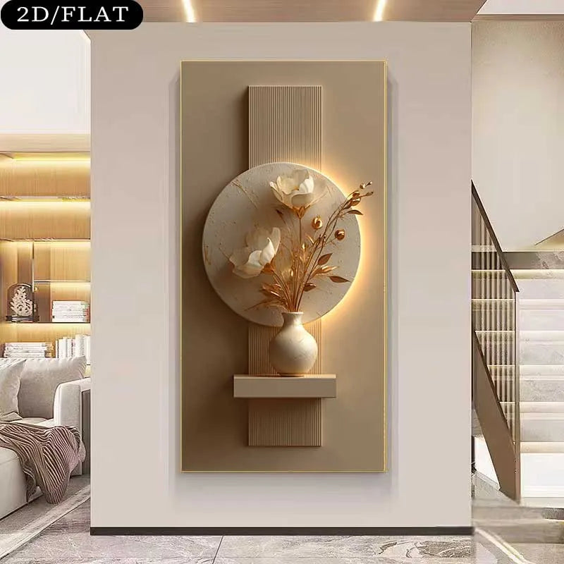 A modern wall art piece featuring a circular beige stone relief with white floral motifs and dried botanical stems in a small vase, mounted on a vertical rectangular panel with integrated warm lighting. The artwork is shown hanging in a contemporary interior hallway with a staircase and shelving visible.