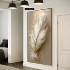 Decorative wall art of a feather with gold accents in a modern interior setting.