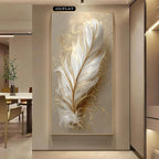 Decorative wall art of a feather with gold accents in a modern interior setting.
