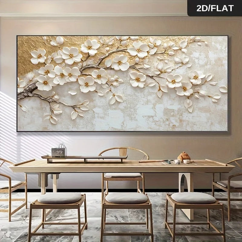 Large rectangular wall art showing a 3D-effect white magnolia blossom branch with gold leaf texture, displayed above a dining table in a modern interior. A small '2D/FLAT' label appears in the top-right corner.