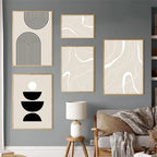 Modern interior with abstract art on a gray wall, a lamp, and a sofa.