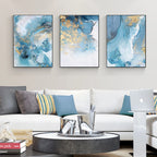 Modern living room with abstract wall art and a white sofa.