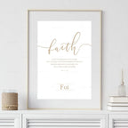 Framed artwork with the word 'faith' on a white wall.
