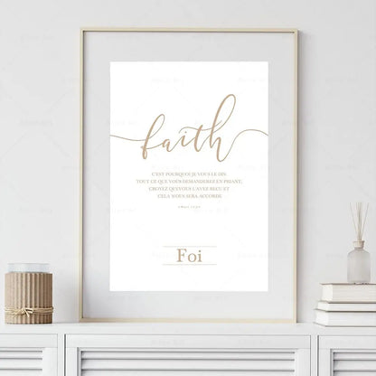 Framed artwork with the word 'faith' on a white wall.