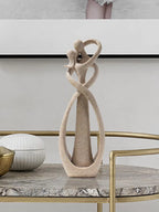 Decorative sculpture on a marble table with a neutral background