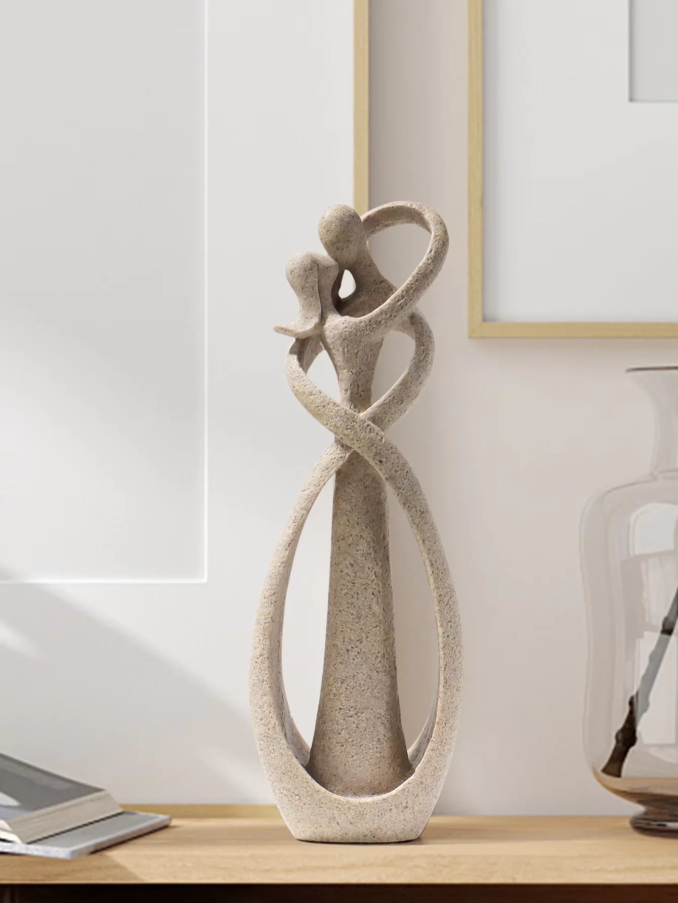 Decorative sculpture on a wooden surface with a neutral background