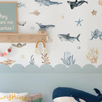 Children's room with ocean-themed wallpaper, toys, and decor.