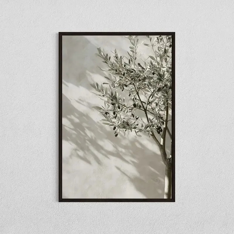 Framed artwork of a leafy branch against a neutral background