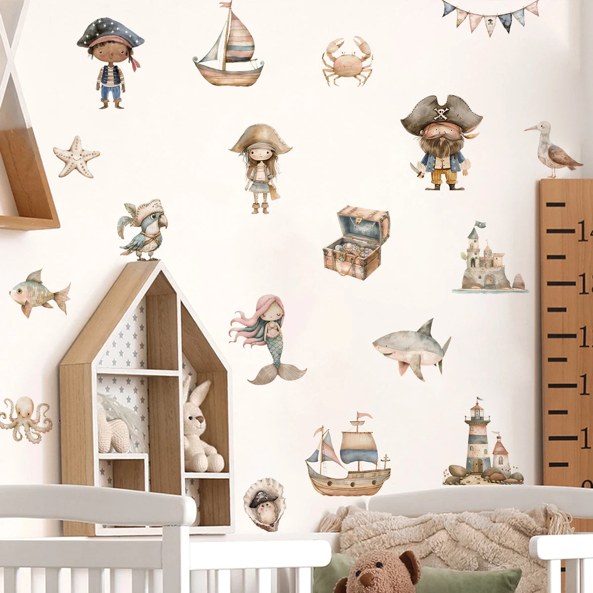 Children's room with pirate-themed wall decals, shelves, and a growth chart.