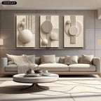 Modern living room with a beige sofa, round coffee table, and abstract wall art.