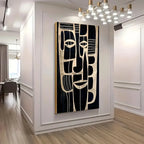 Abstract art piece on a wall in a modern interior setting