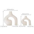 Dimensions of two ceramic vases on a white background
