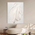 Abstract wall art piece on a beige wall above a sofa