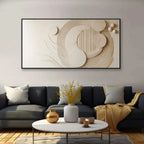 Modern living room with abstract wall art and decorative items.