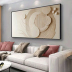 Modern living room with a large abstract wall art piece above a white sofa.