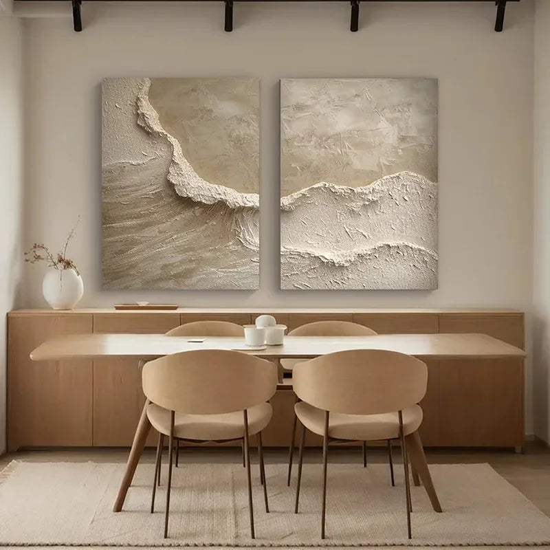Dining room with a table and chairs, featuring two abstract wall arts on the wall.
