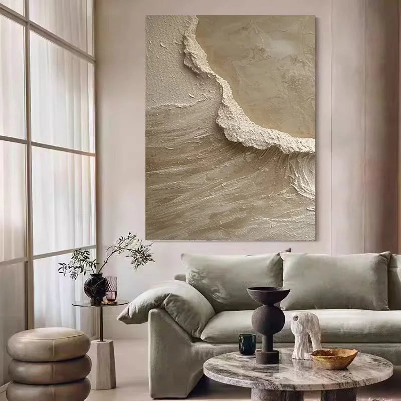 Living room with a large abstract painting on the wall, a gray sofa, and decorative items.
