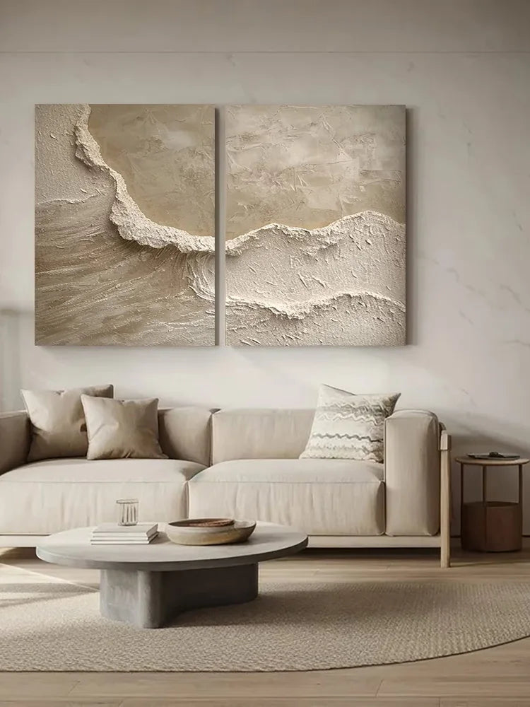Modern living room with a sectional sofa, coffee table, and wall art depicting waves.