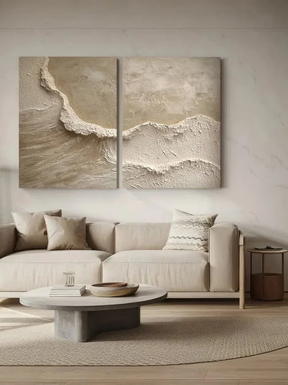 Modern living room with a sectional sofa, coffee table, and wall art depicting waves.