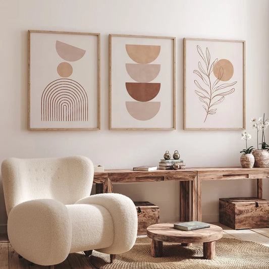 Modern living room with abstract wall art, a beige armchair, and wooden furniture.