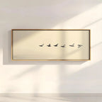 Framed artwork of five birds on a beige background, mounted on a wall.