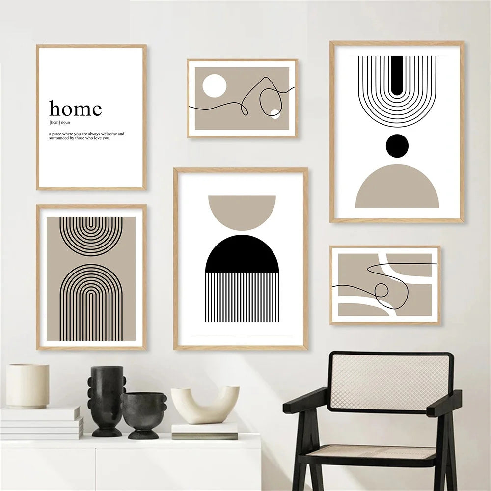 Set of abstract art prints on a wall with a chair and decorative items below.