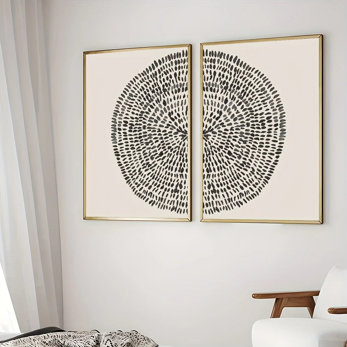 Two abstract art pieces with concentric circles on a white wall.