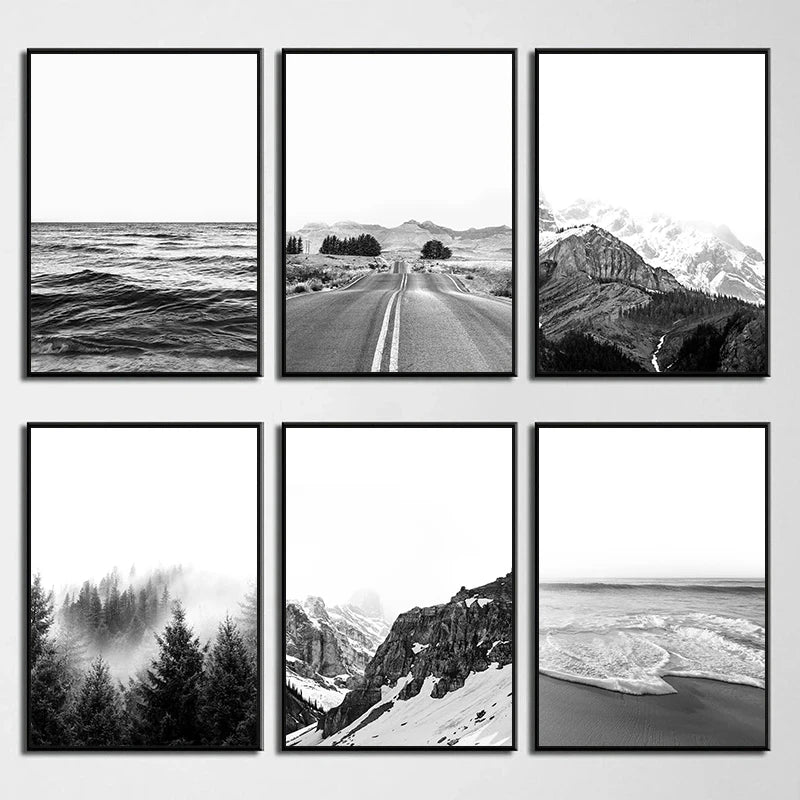 Set of six black and white framed landscapes on a wall.