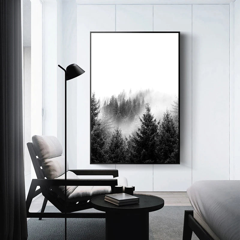 Framed black and white forest print on a wall in a modern living room.