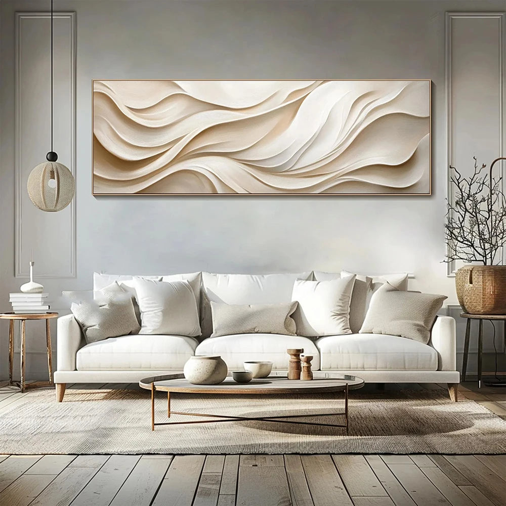 Modern living room with a white sofa, abstract wall art, and decorative items.
