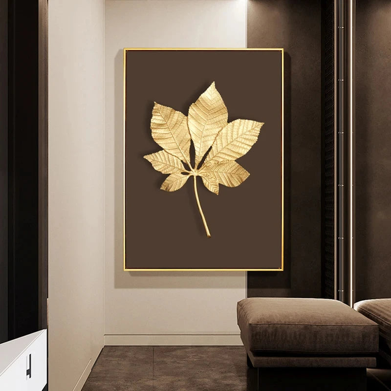 Decorative wall art with gold leaf design on a brown background in a modern interior setting.