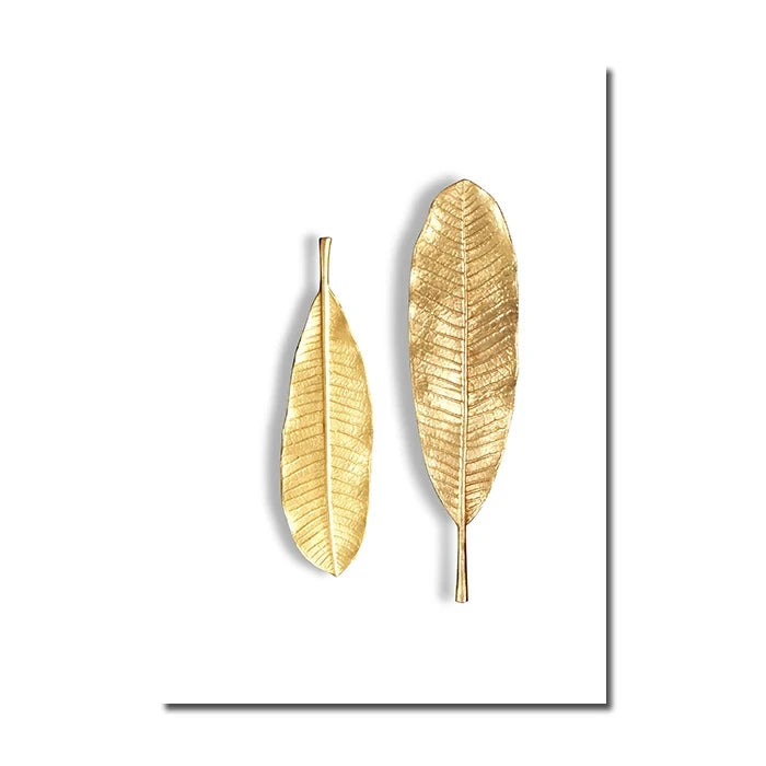 Two gold leaf-shaped wall decor pieces on a white background