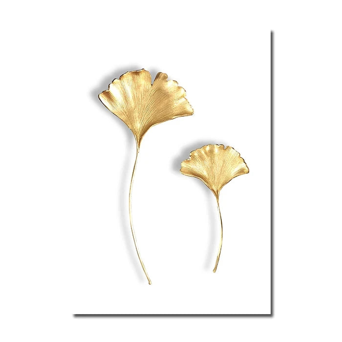 Gold leaf-shaped earrings on a white background